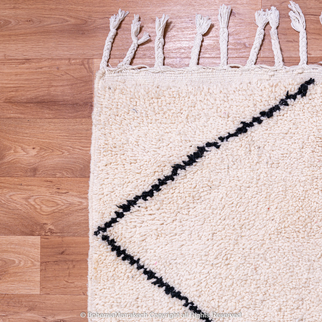Hand-knotted Beni Ourain Moroccan rug with black diamond lines on ivory wool – handmade Berber carpet