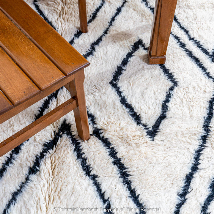 Handwoven Beni Ourain Moroccan runner rug with black diamond pattern on natural wool