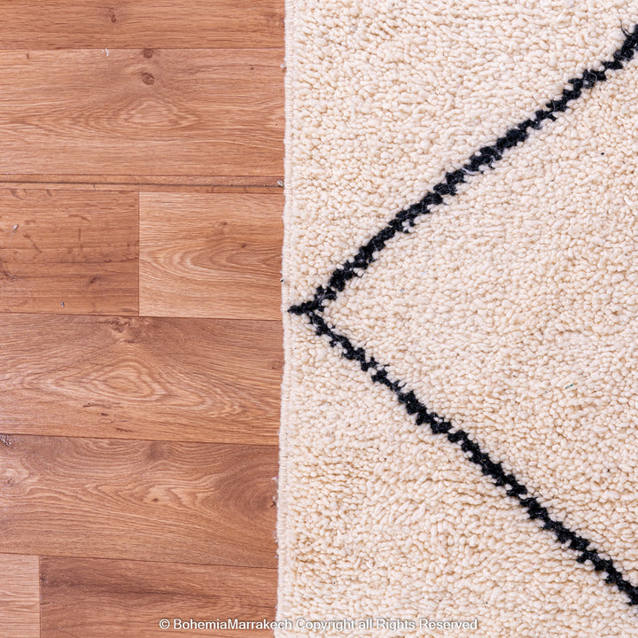 Hand-knotted Beni Ourain Moroccan rug with black diamond lines on ivory wool – handmade Berber carpet