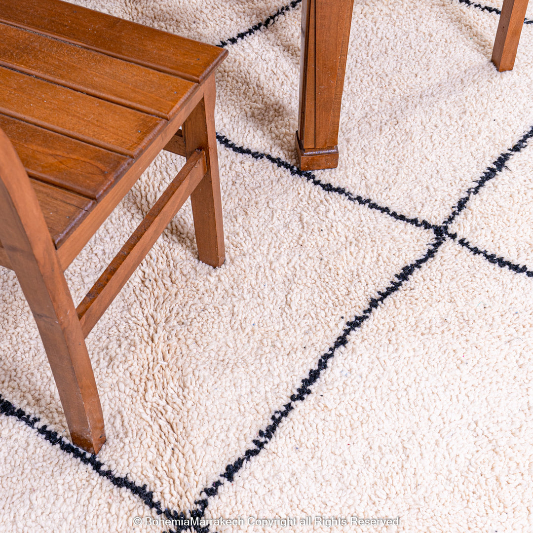 Hand-knotted Beni Ourain Moroccan rug with black diamond lines on ivory wool – handmade Berber carpet