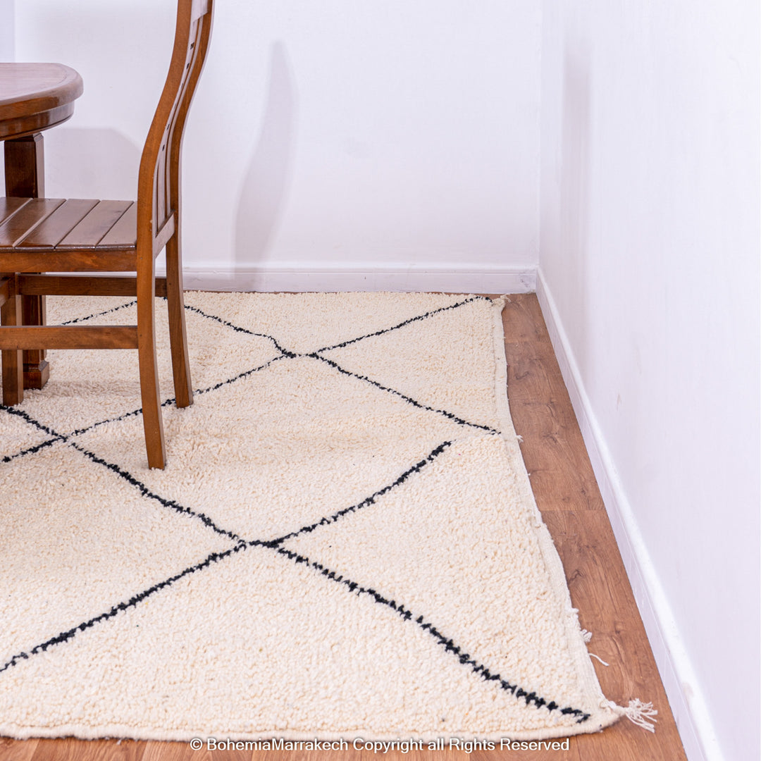 Hand-knotted Beni Ourain Moroccan rug with black diamond lines on ivory wool – handmade Berber carpet