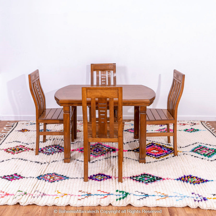 Handwoven colorful Moroccan rug with Berber diamond motifs on white wool base