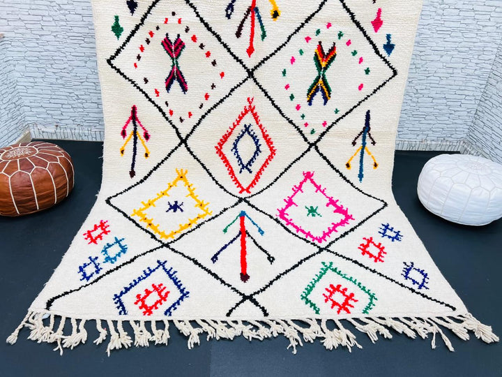 Multicolor Moroccan wool rug with ivory base and colorful Berber diamond patterns