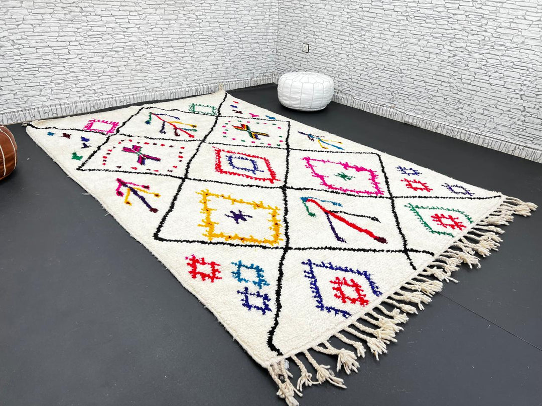 Multicolor Moroccan wool rug with ivory base and colorful Berber diamond patterns