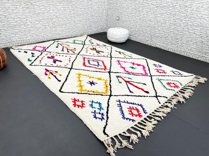 Multicolor Moroccan wool rug with ivory base and colorful Berber diamond patterns