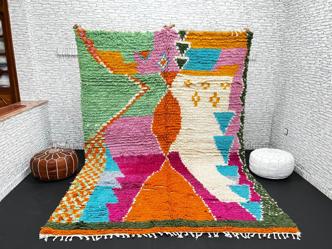 Handwoven multicolor Moroccan wool rug with orange, pink, green, and blue abstract geometric design