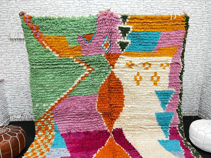 Handwoven multicolor Moroccan wool rug with orange, pink, green, and blue abstract geometric design