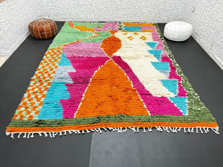 Handwoven multicolor Moroccan wool rug with orange, pink, green, and blue abstract geometric design