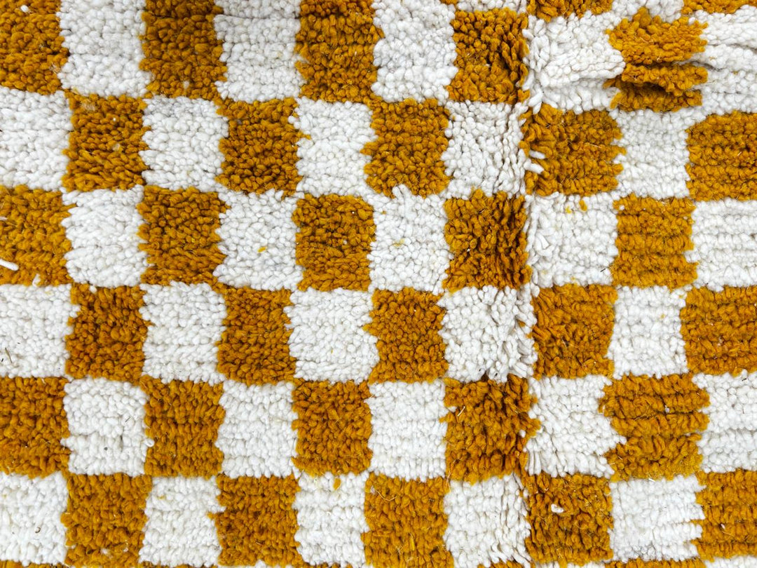 Handwoven mustard yellow and white checkered Moroccan wool runner rug.