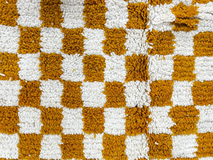 Handwoven mustard yellow and white checkered Moroccan wool runner rug.