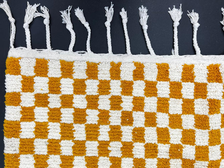 Handwoven mustard yellow and white checkered Moroccan wool runner rug.