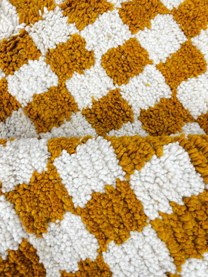 Handwoven mustard yellow and white checkered Moroccan wool runner rug.