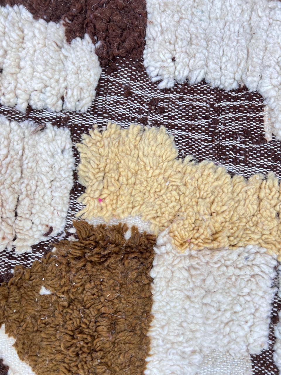 Handwoven Moroccan wool runner rug with abstract white and brown earth-tone pattern