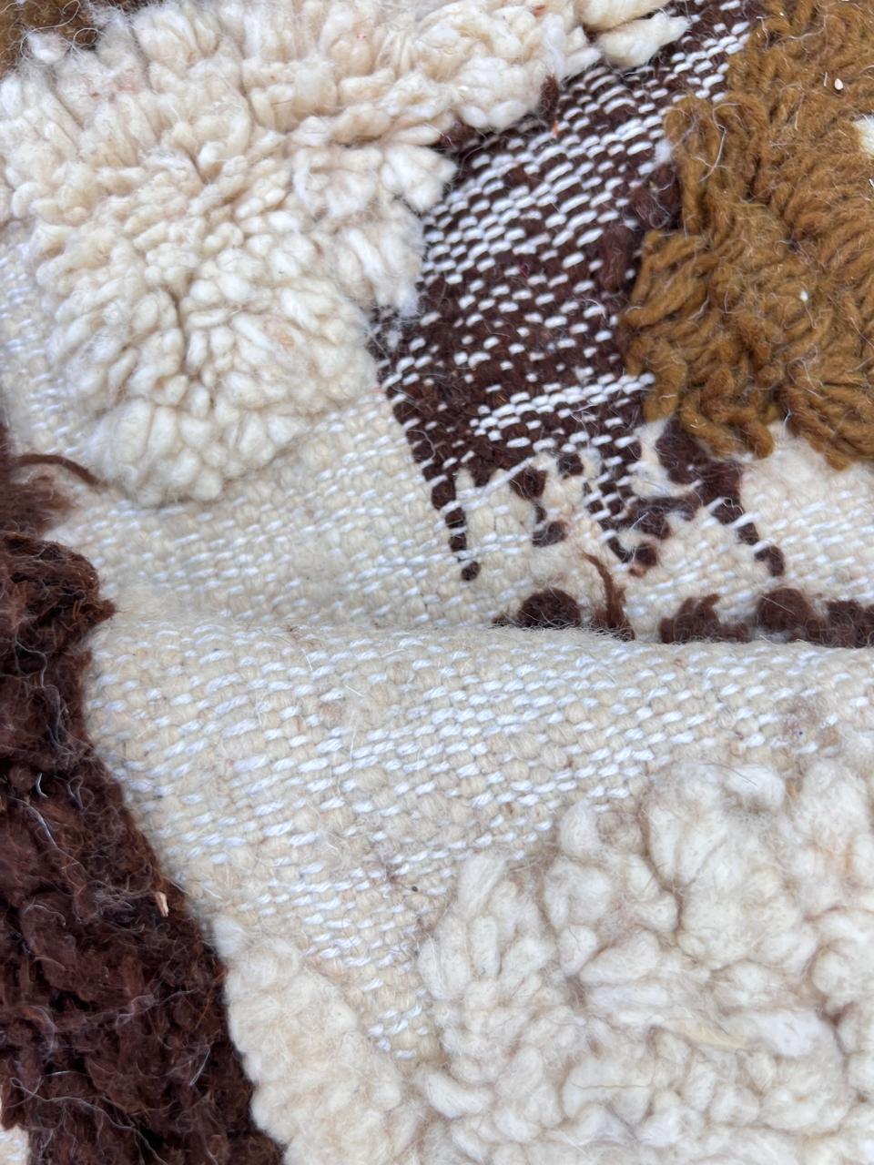 Handwoven Moroccan wool runner rug with abstract white and brown earth-tone pattern