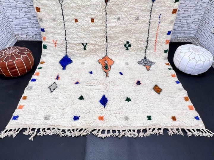 Natural white Moroccan Berber wool rug with symbolic diamond motifs