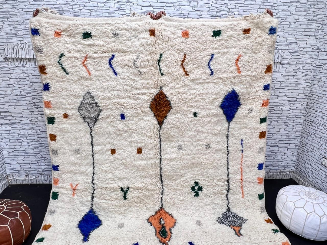 Natural white Moroccan Berber wool rug with symbolic diamond motifs