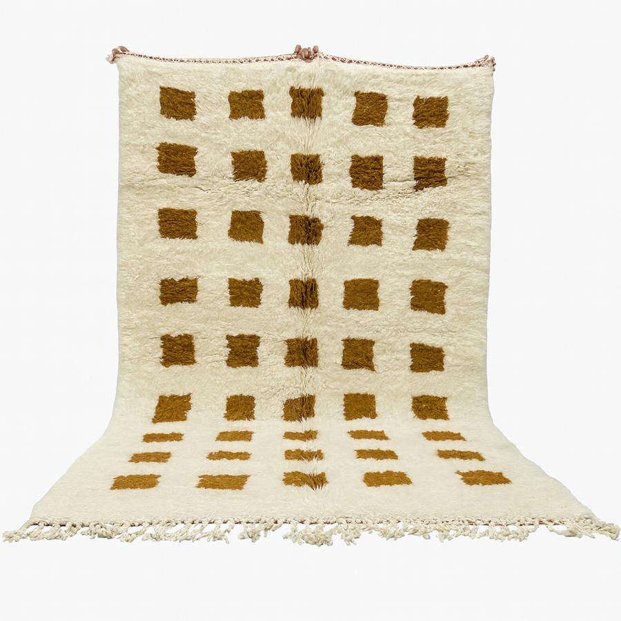 Beige and brown checkered rug with tassels on a white background