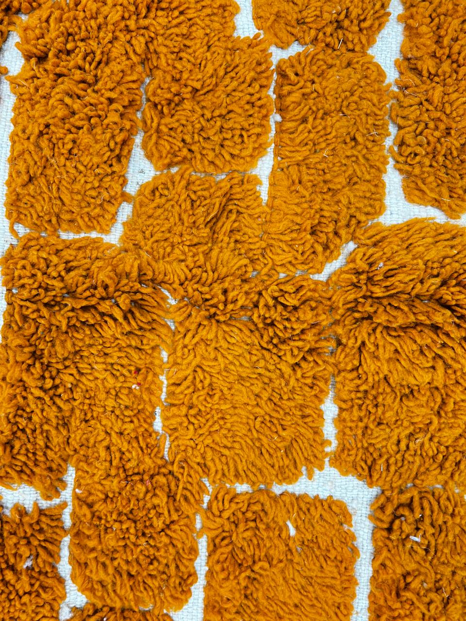 Handmade orange Moroccan runner rug with textured brick pattern in plush wool.