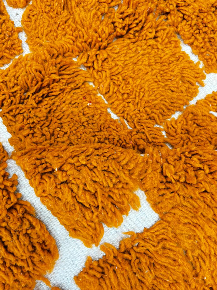 Handmade orange Moroccan runner rug with textured brick pattern in plush wool.
