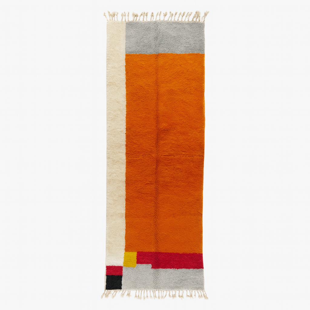 Handmade wool Moroccan runner rug with modern color-blocked design in orange, cream, grey, red, black, and yellow.