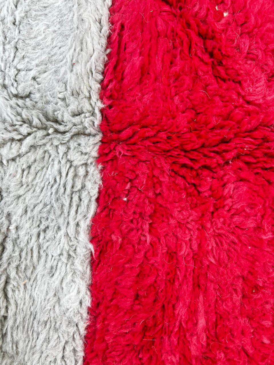 Handmade wool Moroccan runner rug with modern color-blocked design in orange, cream, grey, red, black, and yellow.