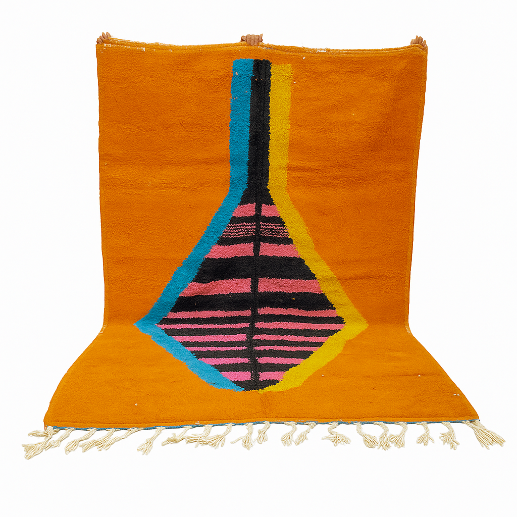 Orange Moroccan wool rug with bold geometric pattern in pink, black, blue, and yellow, handmade by Berber artisans