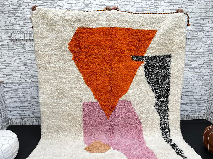 Handwoven Moroccan wool rug in orange, pink, black, and ivory – abstract geometric Berber carpet handmade in Morocco