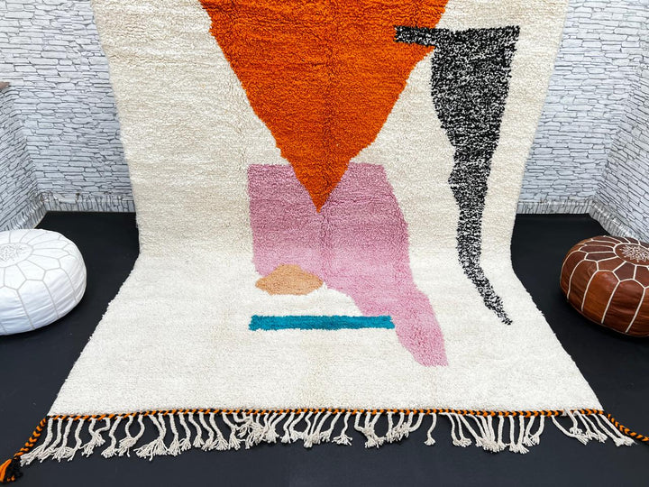 Handwoven Moroccan wool rug in orange, pink, black, and ivory – abstract geometric Berber carpet handmade in Morocco