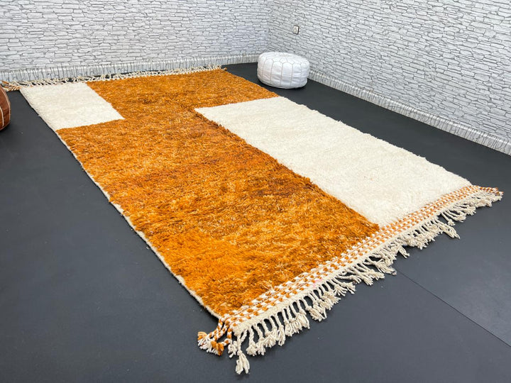 Orange and white handmade Moroccan wool rug with geometric block pattern