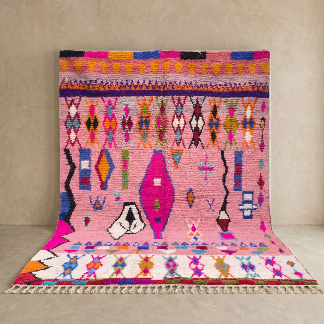 pink handmade moroccan berber rug with geometric tribal patterns in wool
