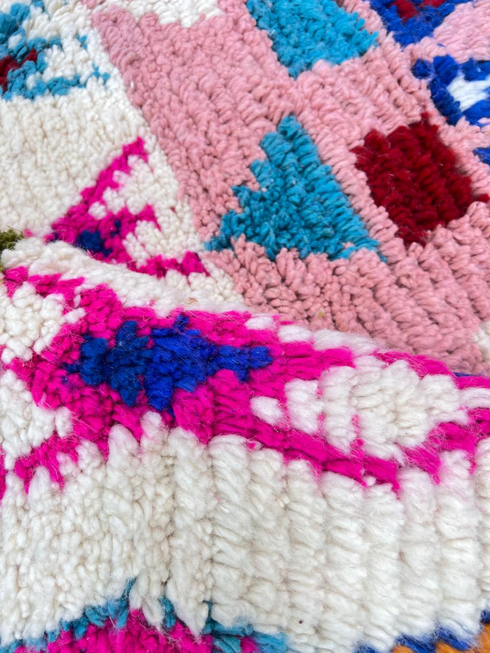 pink handmade moroccan berber rug with geometric tribal patterns in wool