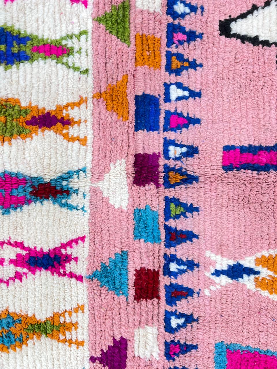 pink handmade moroccan berber rug with geometric tribal patterns in wool