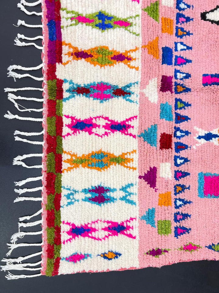 pink handmade moroccan berber rug with geometric tribal patterns in wool