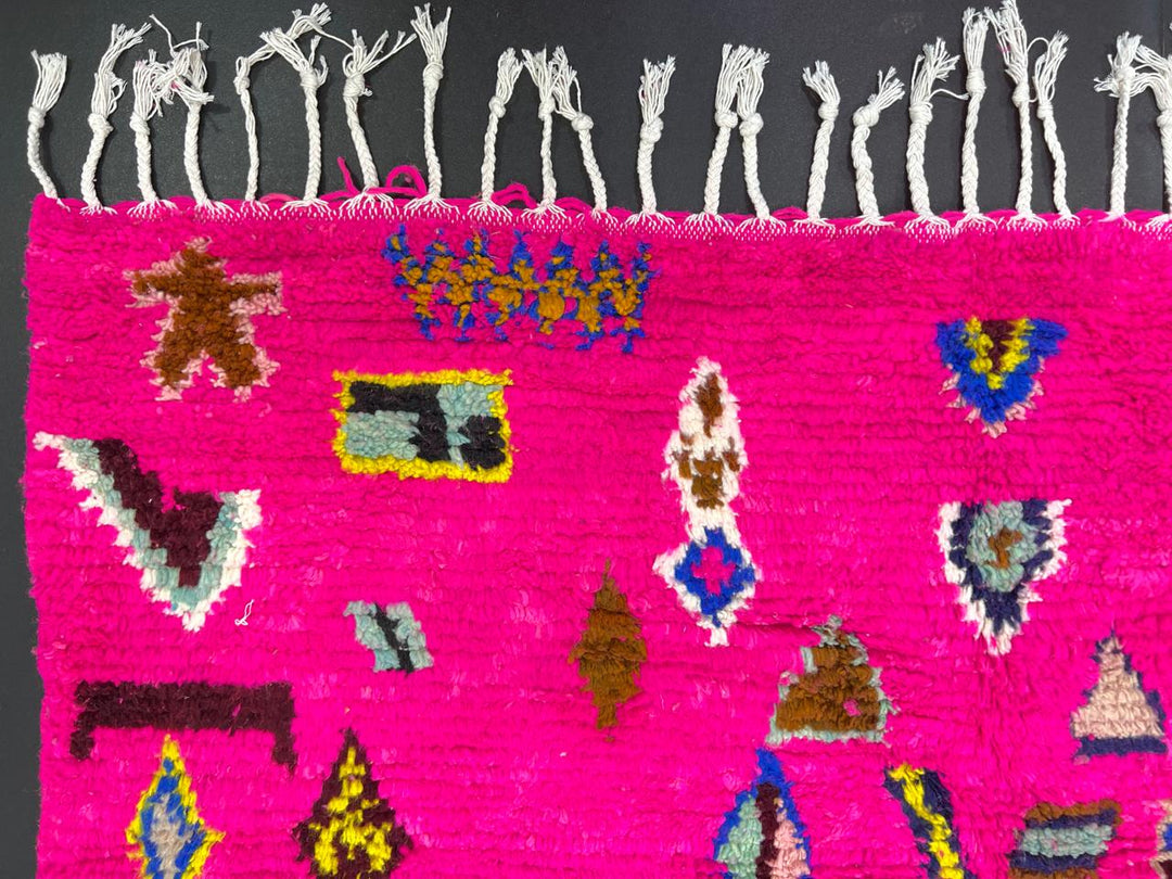 Pink Moroccan runner rug with colorful Berber diamond patterns handmade in wool
