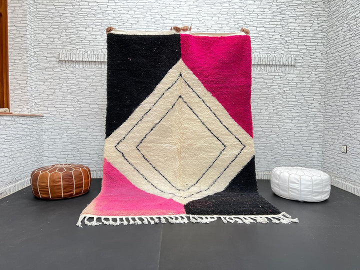 Handmade Moroccan wool rug in pink, black, and ivory with bold diamond geometric design