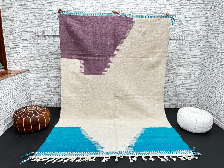 Handwoven Moroccan wool rug in purple, turquoise blue, and cream white – modern flatweave Berber carpet