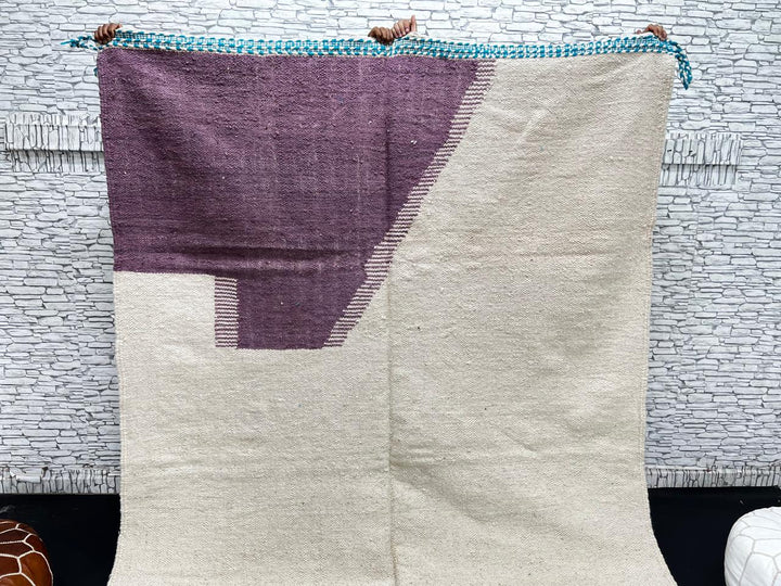 Handwoven Moroccan wool rug in purple, turquoise blue, and cream white – modern flatweave Berber carpet
