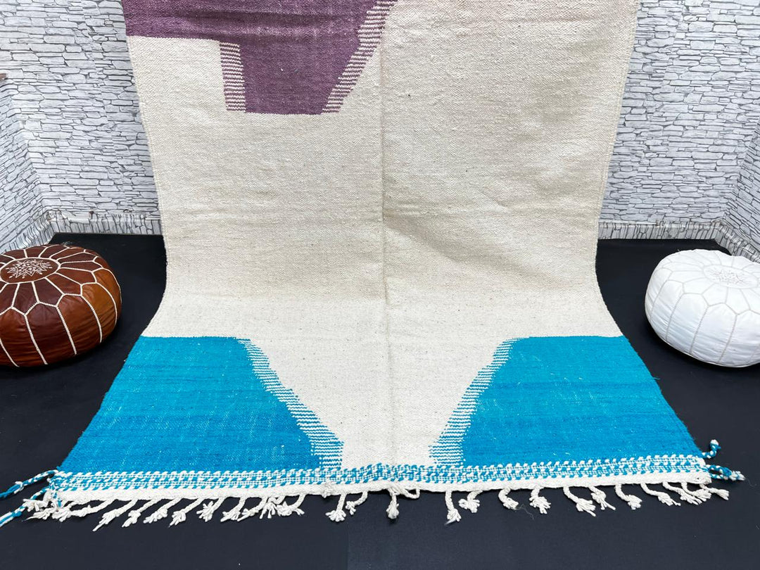 Handwoven Moroccan wool rug in purple, turquoise blue, and cream white – modern flatweave Berber carpet
