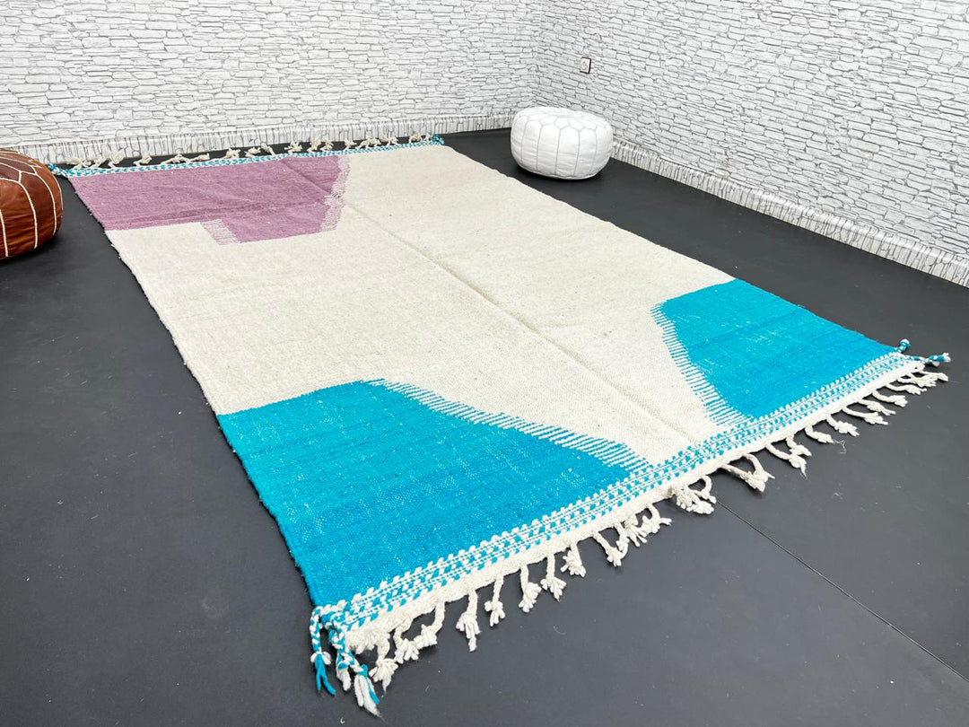 Handwoven Moroccan wool rug in purple, turquoise blue, and cream white – modern flatweave Berber carpet