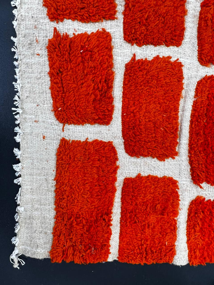 Handmade Moroccan wool rug with red geometric rectangles on cream background – Berber wool carpet