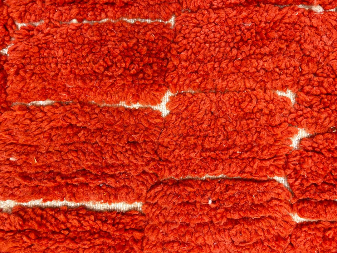 Red Moroccan runner rug with textured shag wool and subtle geometric block pattern, handmade Berber carpet