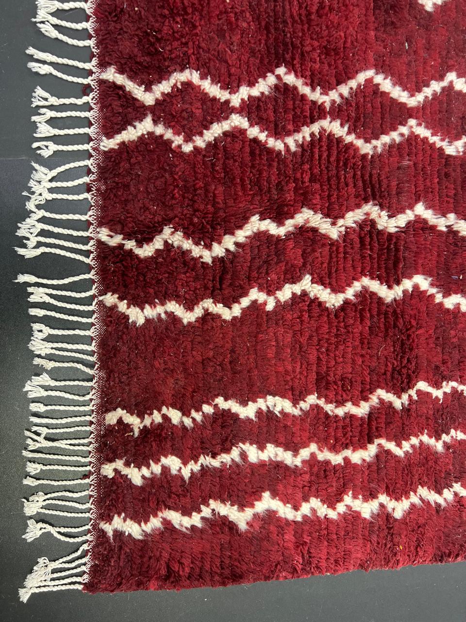 Burgundy Moroccan runner rug handwoven in wine red wool with flowing white ivory lines