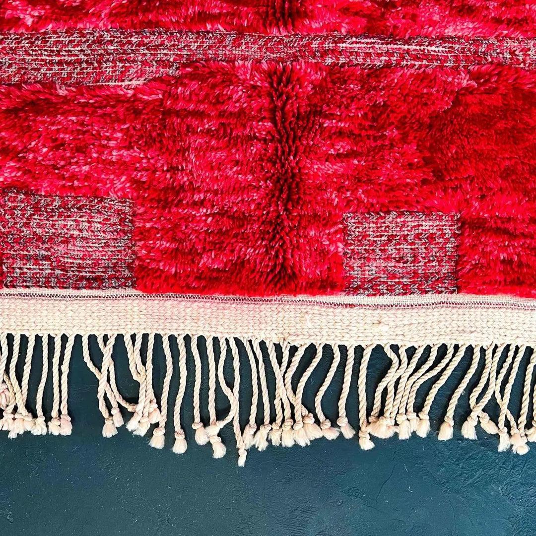 Red Moroccan runner rug handmade Berber wool with geometric pattern and fringes