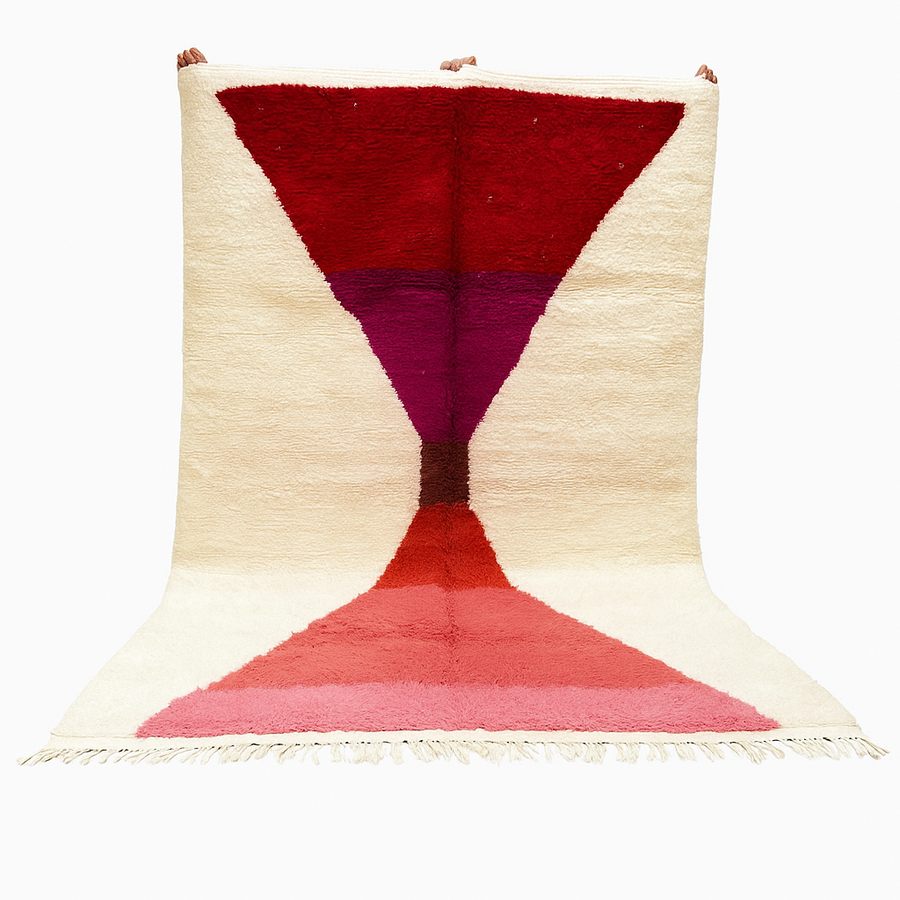 Handwoven Moroccan wool rug in red, pink, and magenta on cream background – modern Berber handmade rug