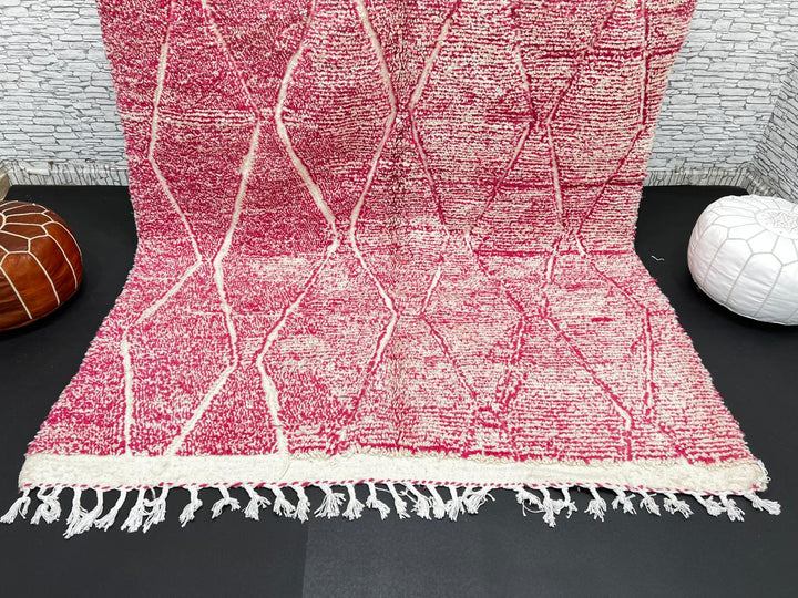 Pink Moroccan wool rug with cream diamond pattern, handmade by Berber artisans in the Atlas Mountains