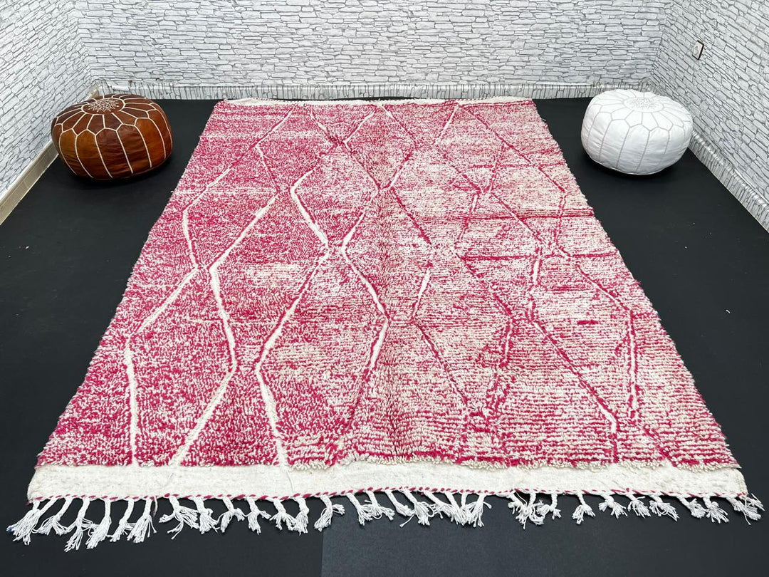 Pink Moroccan wool rug with cream diamond pattern, handmade by Berber artisans in the Atlas Mountains