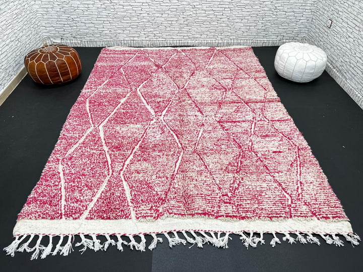 Pink Moroccan wool rug with cream diamond pattern, handmade by Berber artisans in the Atlas Mountains