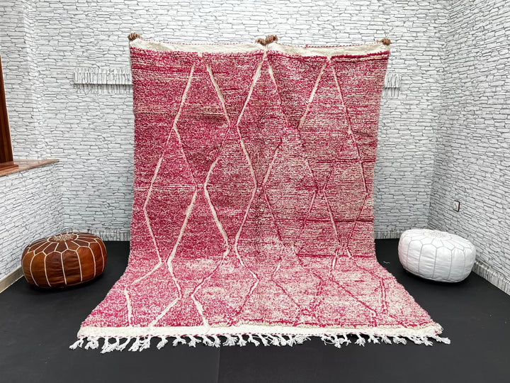 Pink Moroccan wool rug with cream diamond pattern, handmade by Berber artisans in the Atlas Mountains