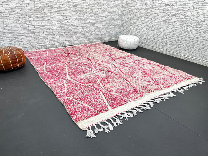 Pink Moroccan wool rug with cream diamond pattern, handmade by Berber artisans in the Atlas Mountains