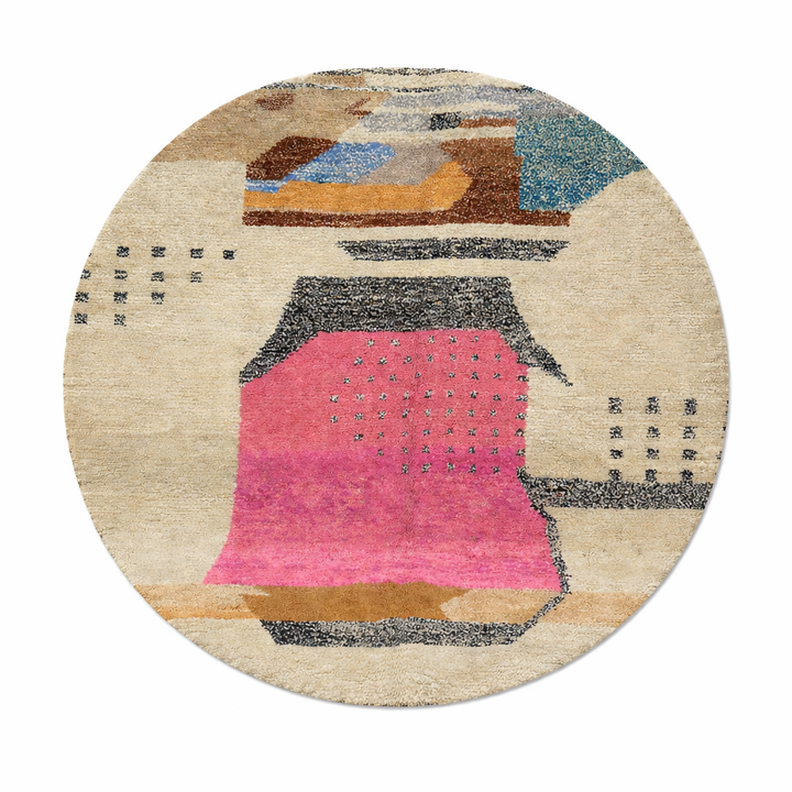 Round handmade Moroccan wool rug with abstract artistic design in pink, blue, caramel and neutral tones